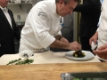 Chef Daniel Boulud putting finishing touches on his dish