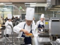 BocuseVegas2026_UNLV-301-P.Liu-cooking-CreditKenGoodman