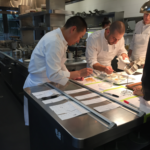 chef lee and chef de cuisine at the pass